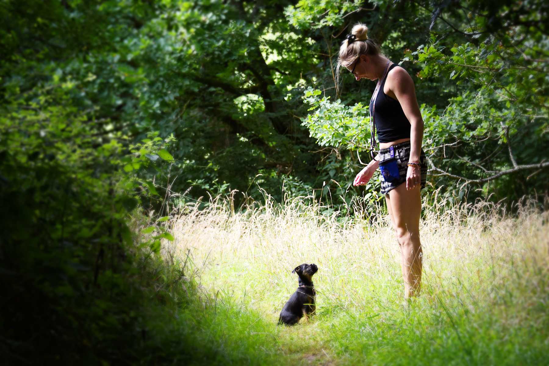 Border Terrier puppy and owner for illustration of question What should I wear for my dog photo shoot
